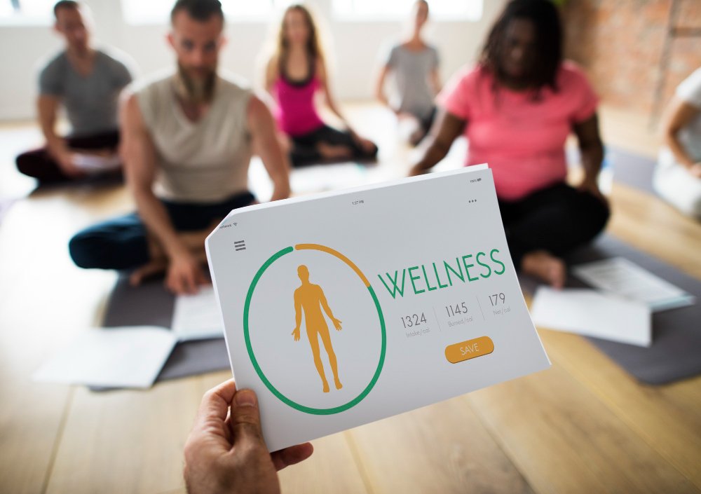 Group practising a guided mind-body wellness session