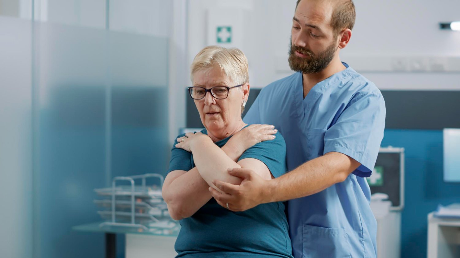 Clinician reviewing a diagnostic scan during a pain care consultation